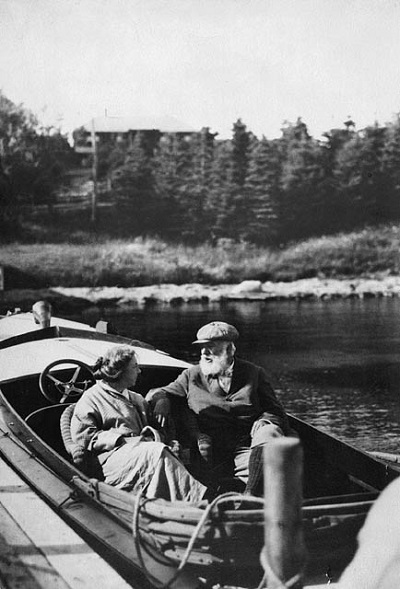 Black and white photo of a women and a man in a small boat