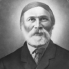 Black and white image of a man with a white beard