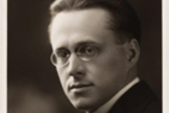 Photo in sepia of man wearing glasses