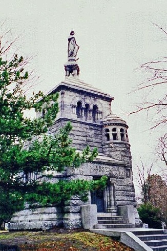 Photo of a tall monument building at a cemetery 