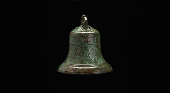 The bell, green and brown in appearance.