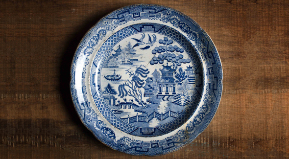A white plate with blue patterns.