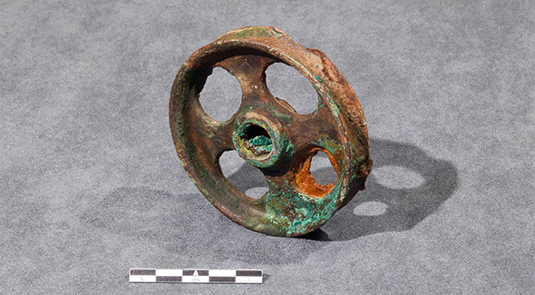 One of three recovered grooved wheels with 4 holes.