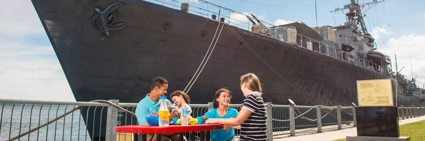 Visitors have a picnic by the HMCS Haida ship