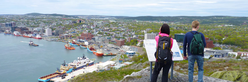 Two people appreciate the view of St. John's from the Gibbet Hill Trail