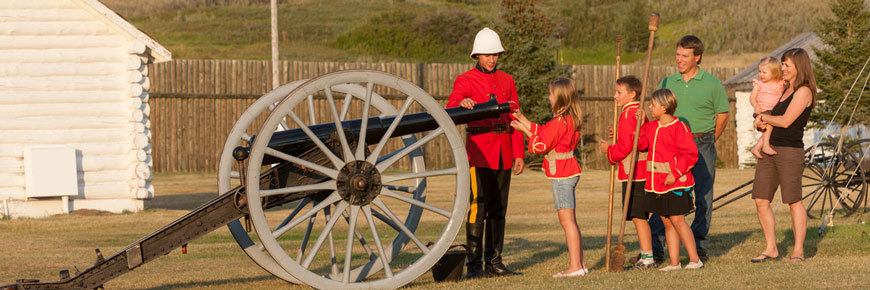 Mountie with cannon and family.