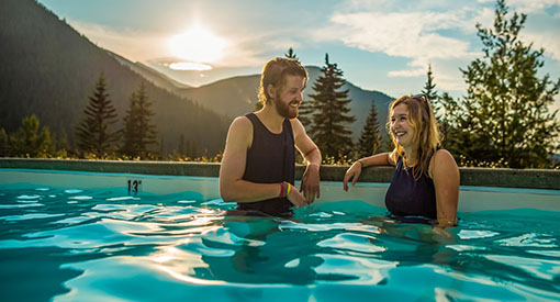 A couple soaking in the hot springs pool