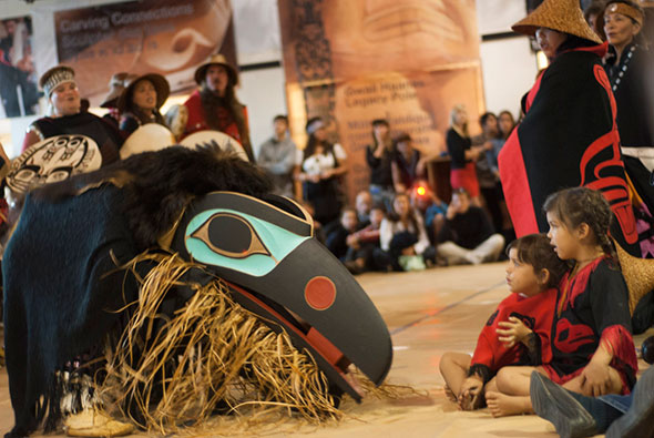 Haida dancers with a Raven mask