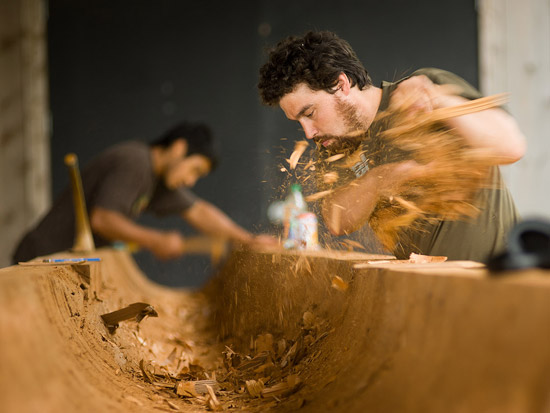 Tyler (left) and Jaalen (right) hollow out the log