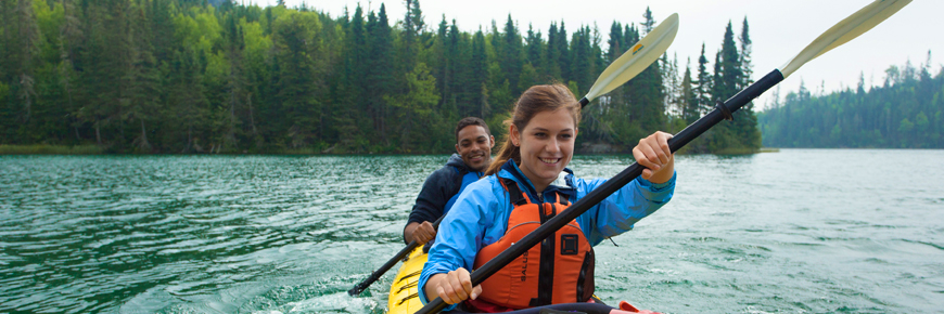 Two people in a tandem kayak.