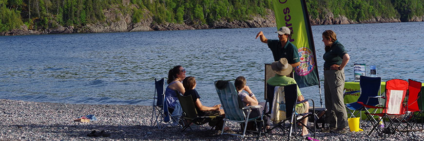 Parks Canada staff lead a campfire program at Schreiber beach on Lake Superior (photo taken prior to the pandemic). 