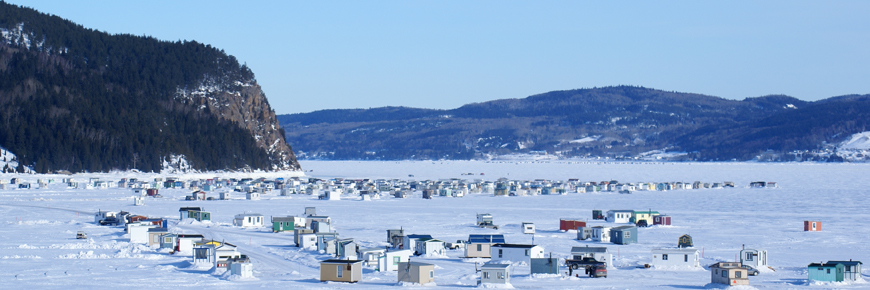 View of an ice fishing village on the frozen Saguenay River.