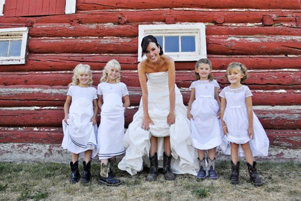 Bride and flower girls show off their cowgirl boots