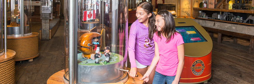 Two girls get hands-on with interactive exhibit