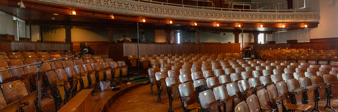 A view of the wooden seats in a historic theatre