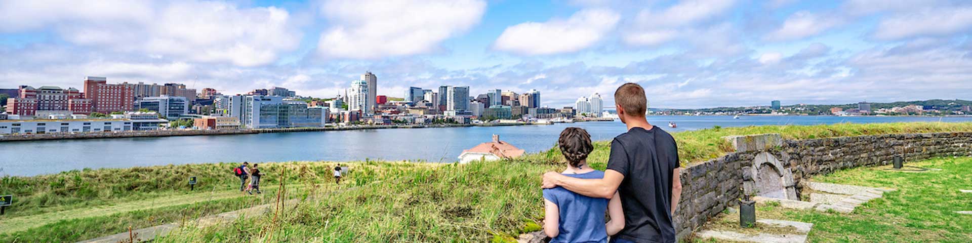 A couple enjoying views of Halifax from Georges Island.