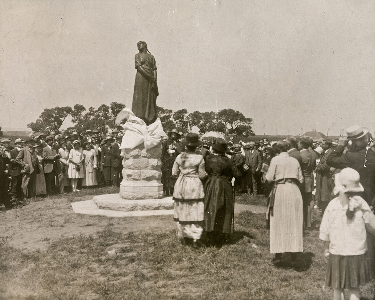 People gathered around the statue of Evangeline for its unveiling.
