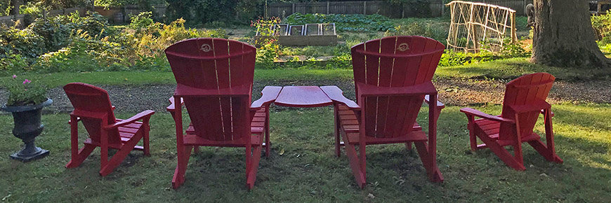 Red chairs looking over the gardens. 