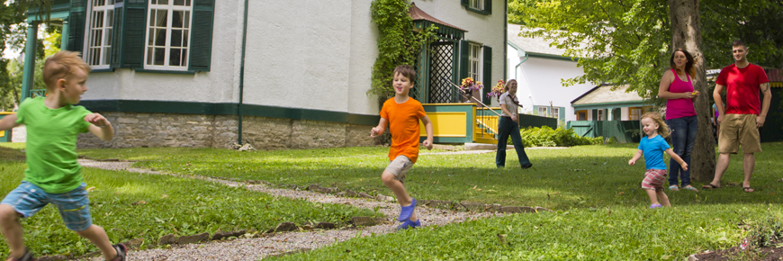 Kids run around the grounds of Bellevue House.