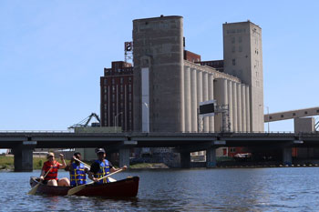 Small group in a canoe on the Lachine Canal