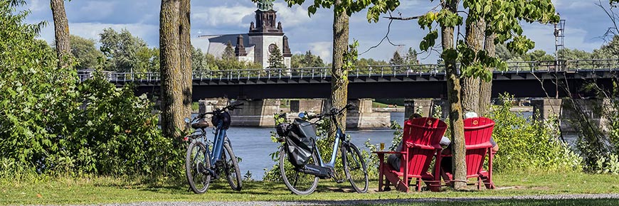Take a break and enjoy the beautiful landscapes during a bike ride along the banks of the Chambly Canal National Historic Site.