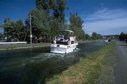 Forefront, boats going towards lock number 7. Background, viaduct of route 112 in Chambly.