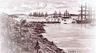 lignée de bateaux sur le fleuve attendant pour pouvoir être accueillis sur la Grosse-Île