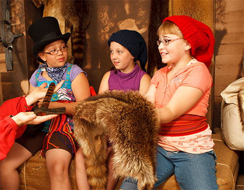 Young girls playing to fur trade