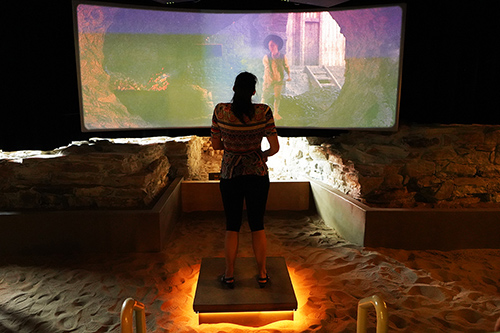 A visitor participates in the new immersive experience 1600 degrees Celsius trial by Fire