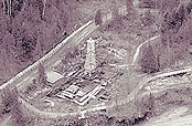 A photography showing an airview of the lower forge site during the archaeological diggins of the seventies. We can see the high chimney impresive vestige of the orginal forge.