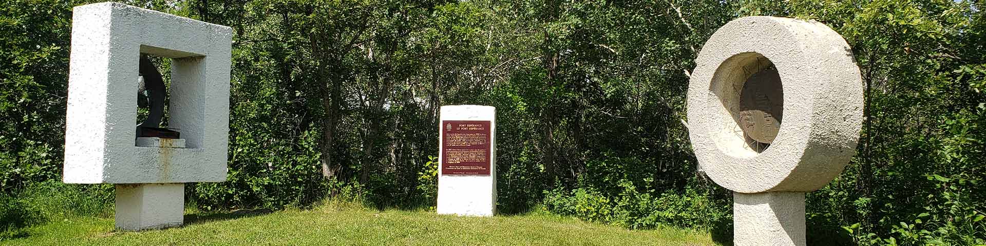 View of the sculptures and the Historic Sites and Monuments Board plaque at Fort Espérance
