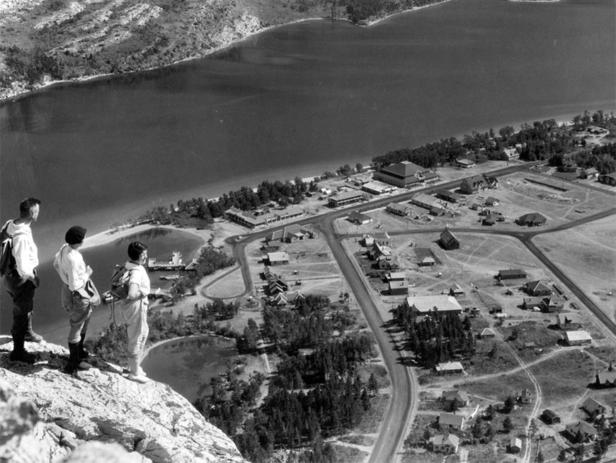 Visitors look over the Waterton townsite from the top of the Bear's Hump trail