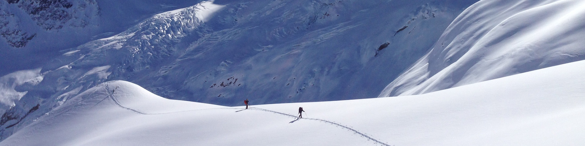 Two Skiers touring in snowy conditions