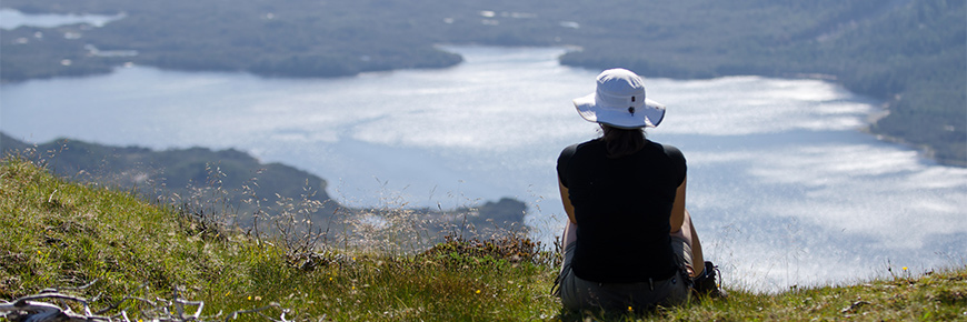 A visitor checks out the Islands of Beauty from Mt. Yahtza
