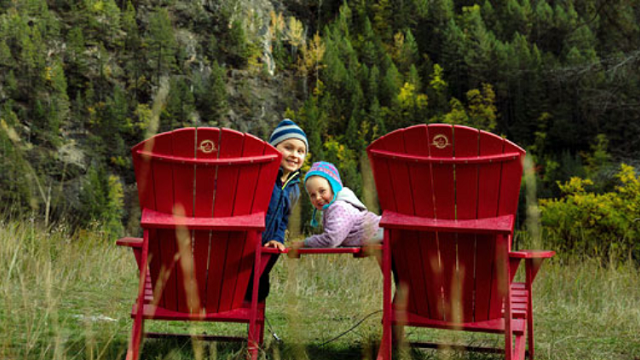 children playing on red chairs