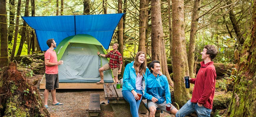  Group of friends relax by their tent