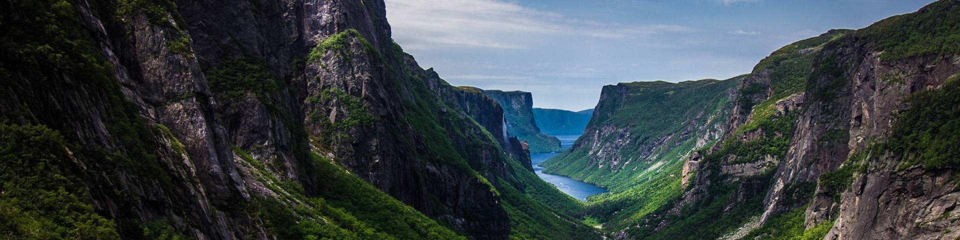 Tall cliffs rise on either side of the gorge at Western Brook Pond in Gros Morne National Park