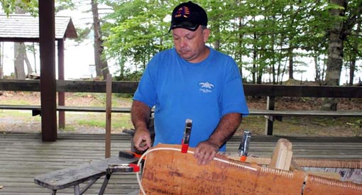 Todd Labrador building a birch bark canoe.