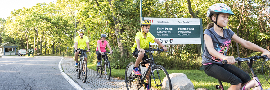 A young family enjoying a bike ride at Point Pelee.