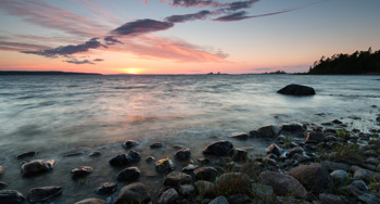 sunset on a rocky shoreline.