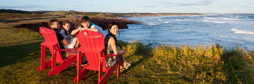 Red chairs in PEI National Park.