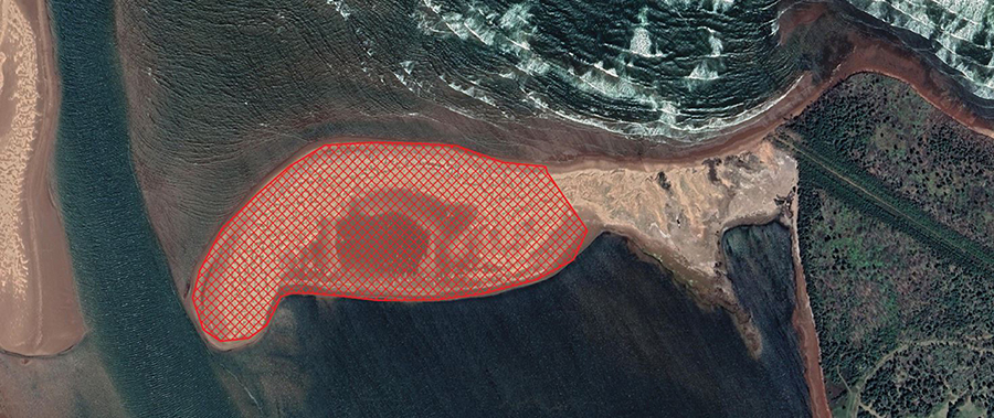 Aerial photo with closure area marked with red.