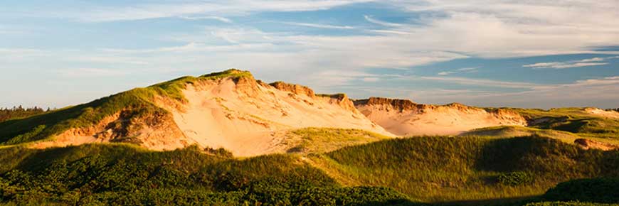 Parabolic dunes at Greenwich in PEI National Park with the sun setting. 