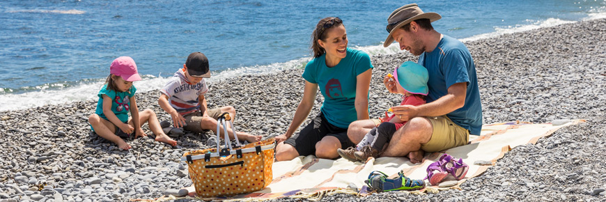  A family picnic on a pebble beach
