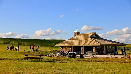 People gather outside of Coulee Centre at the Frenchman Valley Campground.