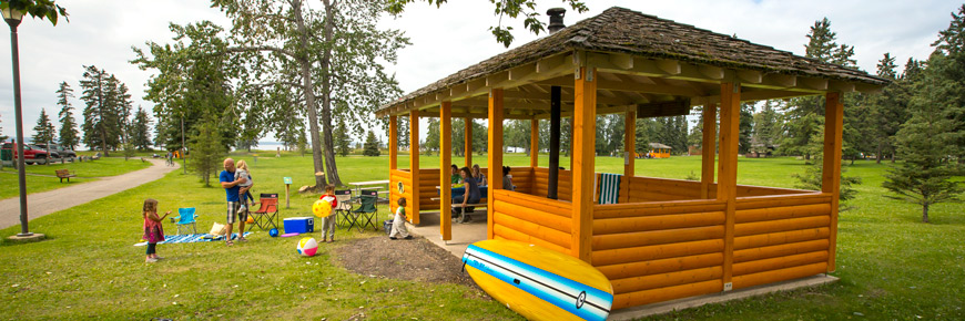 A group of visitors enjoy a picnic shelter in the town of Waskesiu.