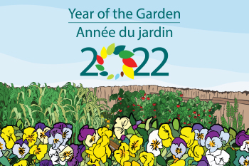 Illustration of a blue sky with text that reads “Year of the Garden 2022”, a brown fence with animated produce plants in the middle-ground and yellow, purple and white flowers in the foreground. 