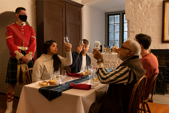 A group of visitors tasting whiskey.